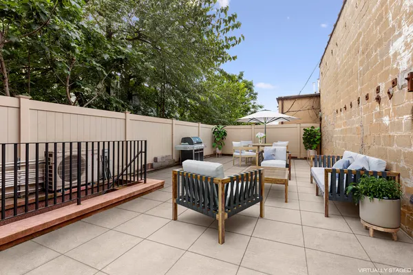 a workspace with wooden floor and furniture