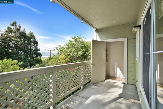 a view of a hallway with a livingroom and closet