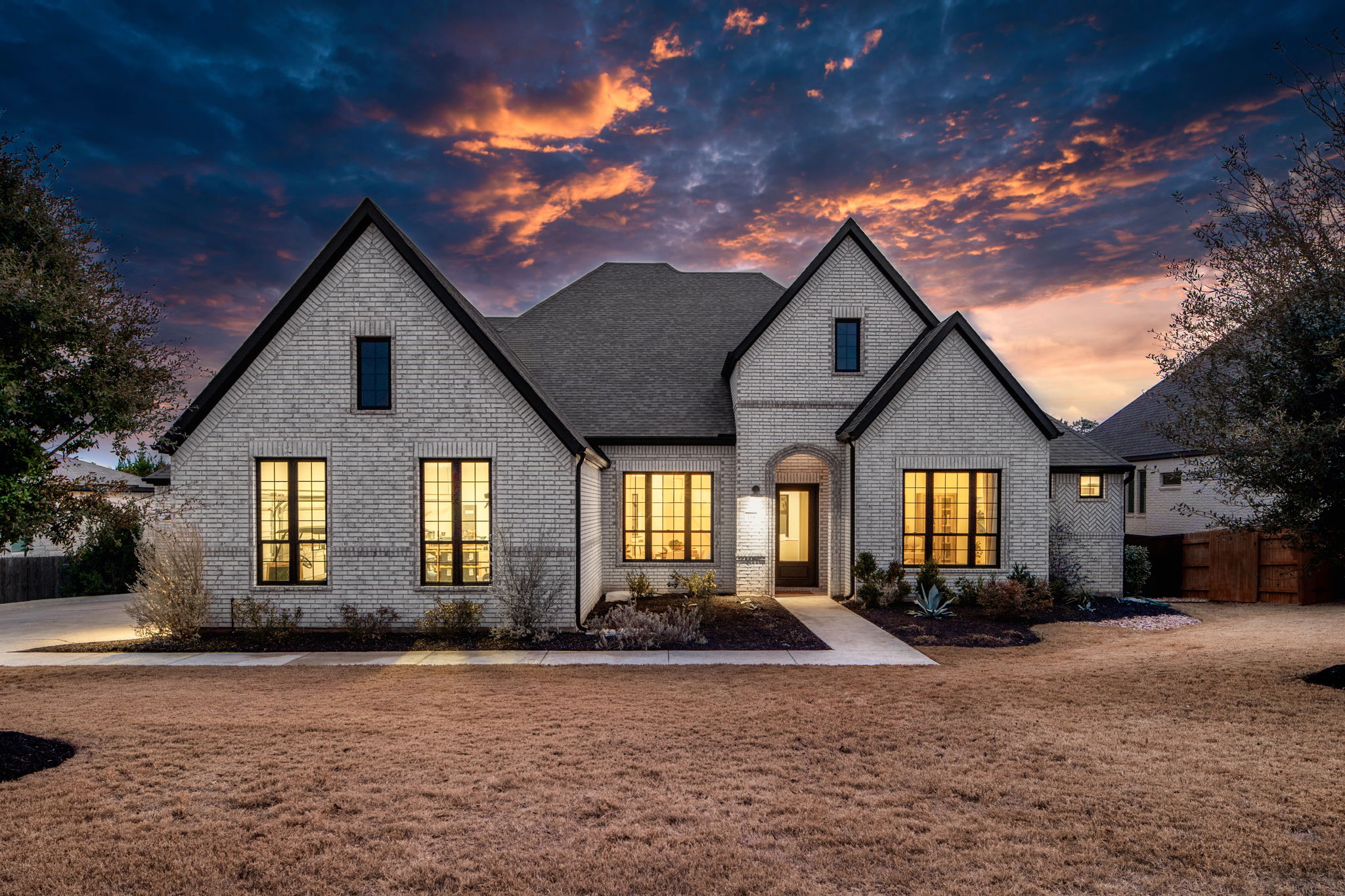 734 Bridge Water Loop Dripping Springs, TX 78620 - Photo 1 of 1 Stunning French country-inspired brick facade, one story home with upgraded black windows