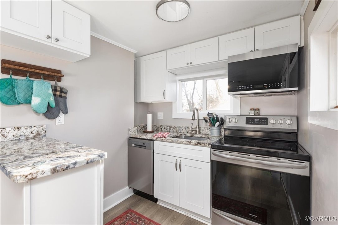 885 South Maple Road Mount Jackson, VA 22842 - Photo 6 of 48 a kitchen with a sink stove and microwave