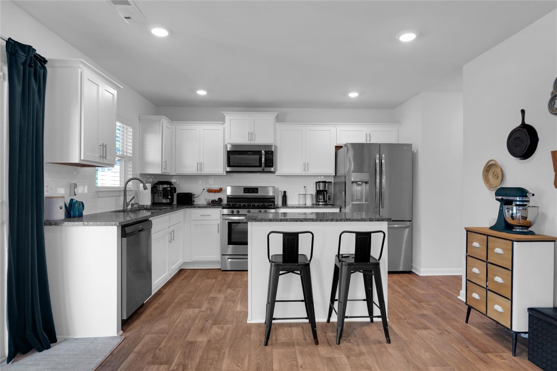 34 Karkinnen Court Pendleton, SC 29670 - Photo 11 of 36 Bright and open, this modern kitchen features an inviting central island and gleaming stainless steel appliances.