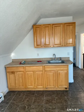 an empty room with a empty space and window