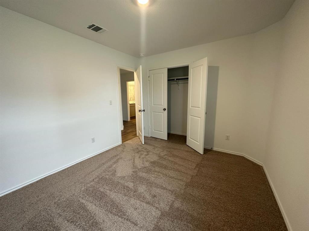 346 Carmello Kyle, TX 78640 - Photo 14 of 39 Unfurnished bedroom with carpet flooring and a closet