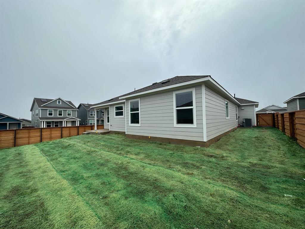 346 Carmello Kyle, TX 78640 - Photo 36 of 39 Back of house featuring a fenced backyard and a gate