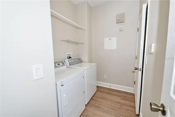 a bathroom with a sink a toilet a tub and shower