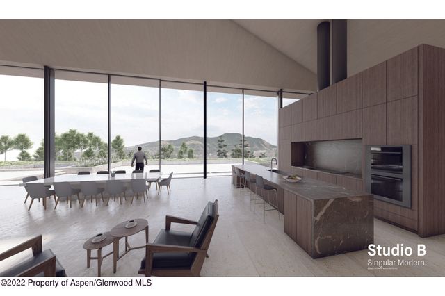 a living room with furniture tv and a floor to ceiling window