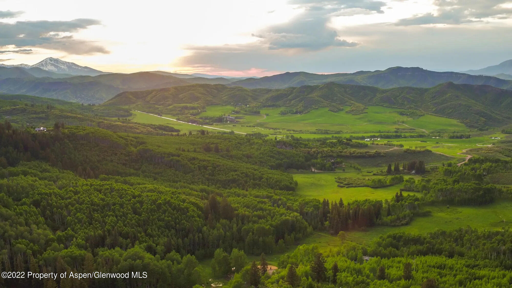 Tbd Eagle Pines Drive Aspen, CO 81611 - Photo 3 of 32 a view of a lush green hillside and mountains