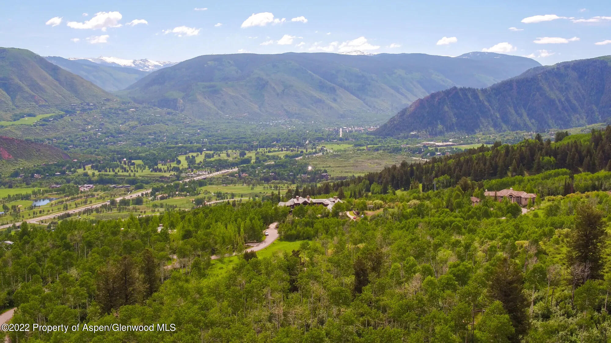 Tbd Eagle Pines Drive Aspen, CO 81611 - Photo 7 of 32 a view of a lush green field with an ocean