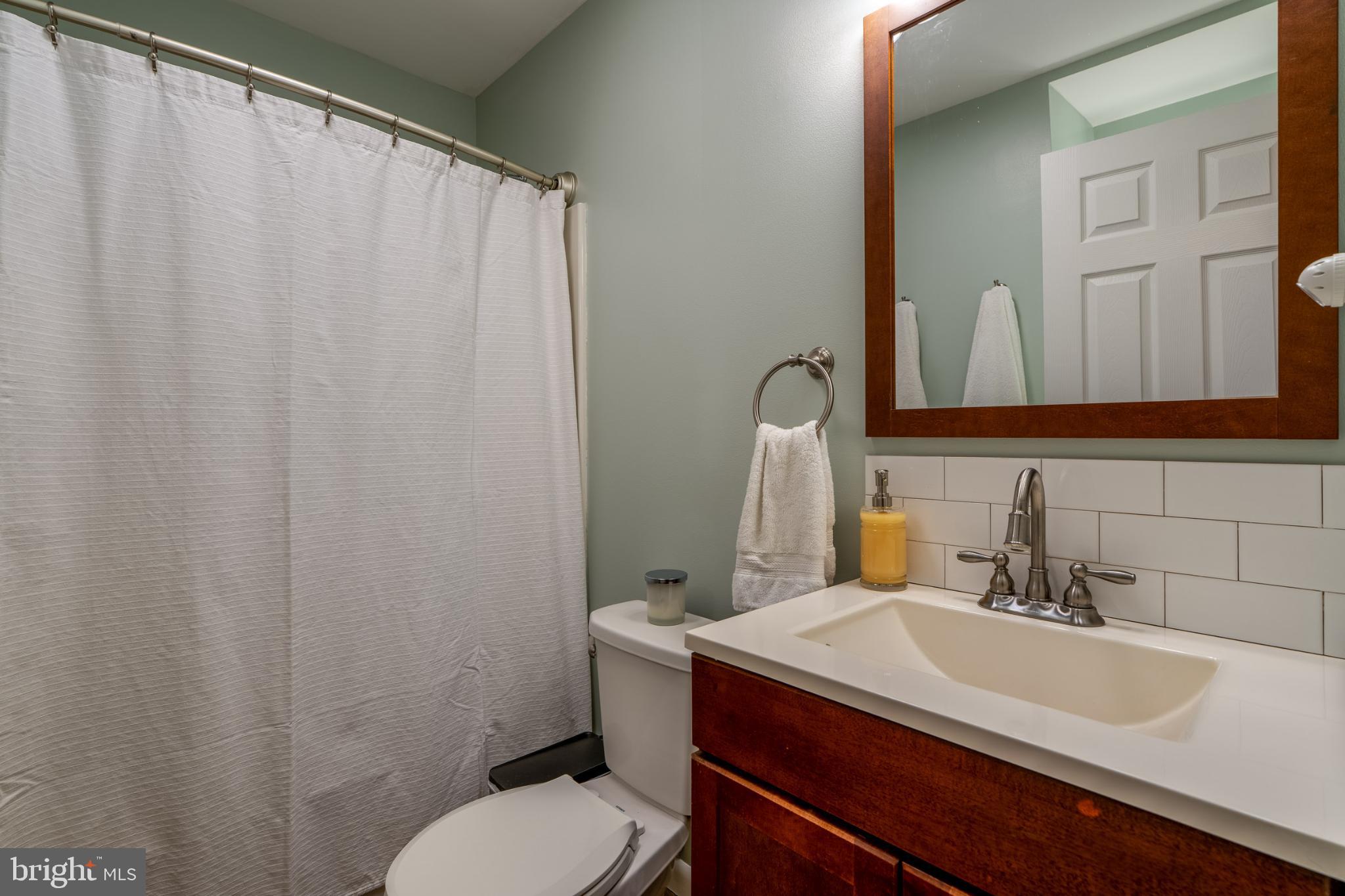 534 West Marion Street Lititz, PA 17543 - Photo 22 of 43 a bathroom with a sink vanity mirror and toilet