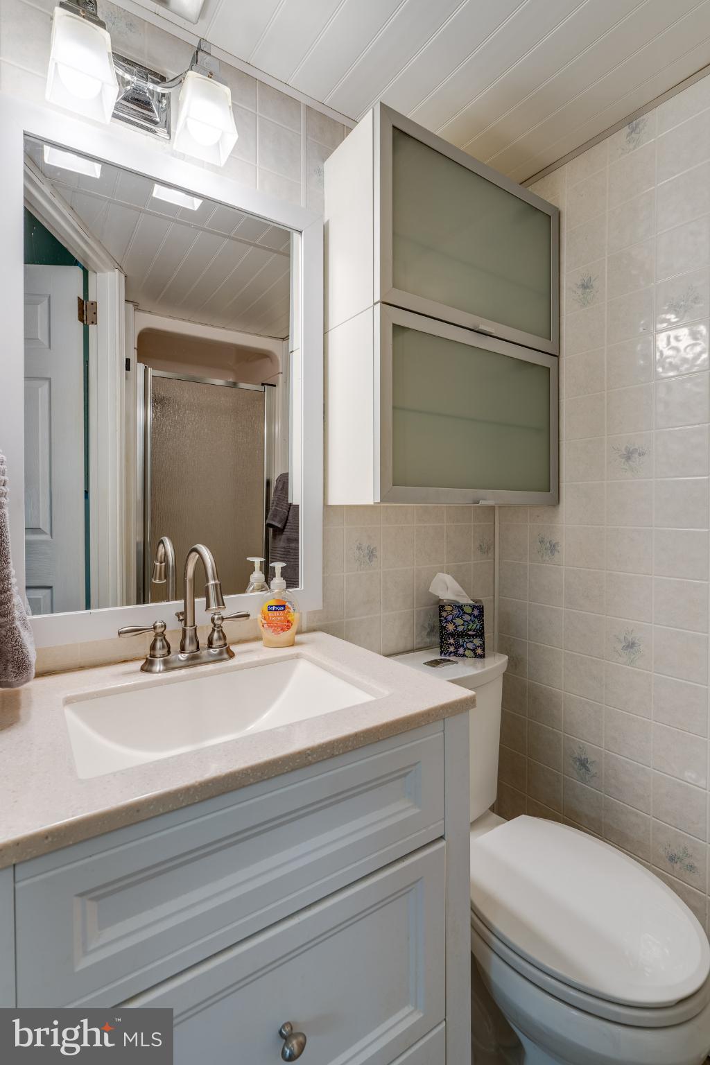 534 West Marion Street Lititz, PA 17543 - Photo 30 of 43 a bathroom with a sink toilet and mirror