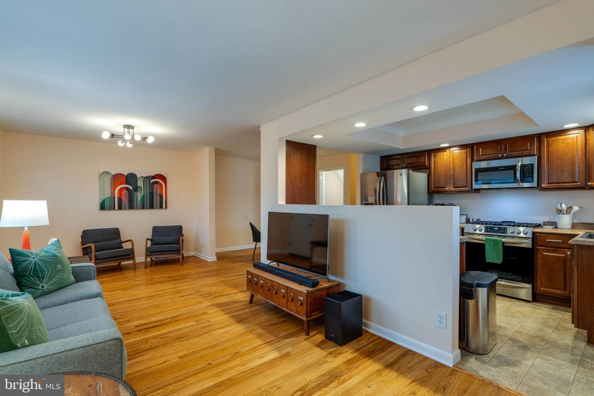 534 West Marion Street Lititz, PA 17543 - Photo 8 of 43 a living room with stainless steel appliances furniture and a flat screen tv