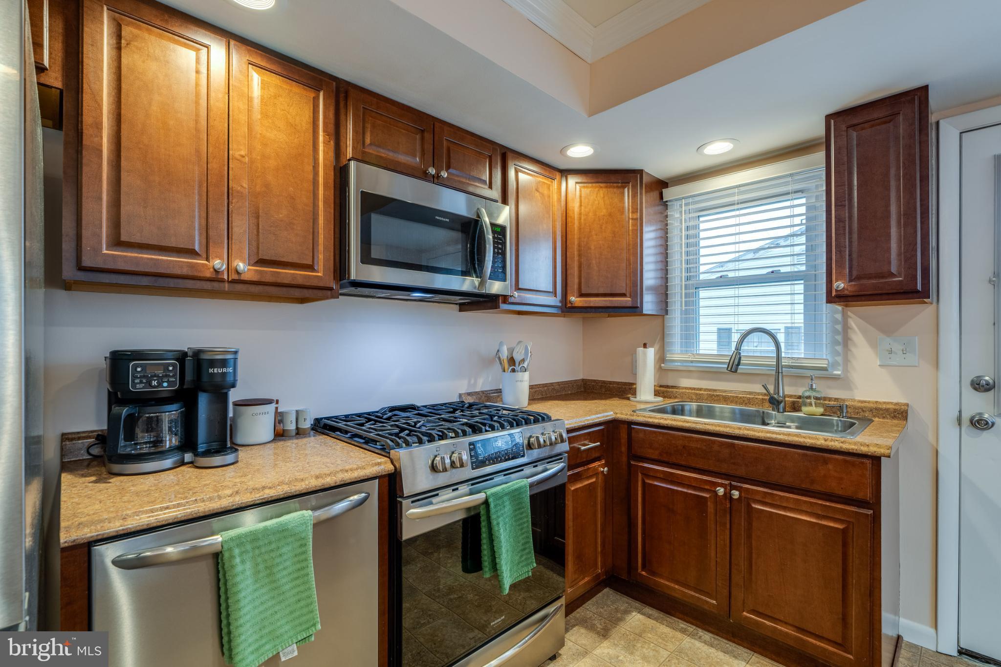 534 West Marion Street Lititz, PA 17543 - Photo 10 of 43 a kitchen with stainless steel appliances granite countertop a stove a sink and a microwave