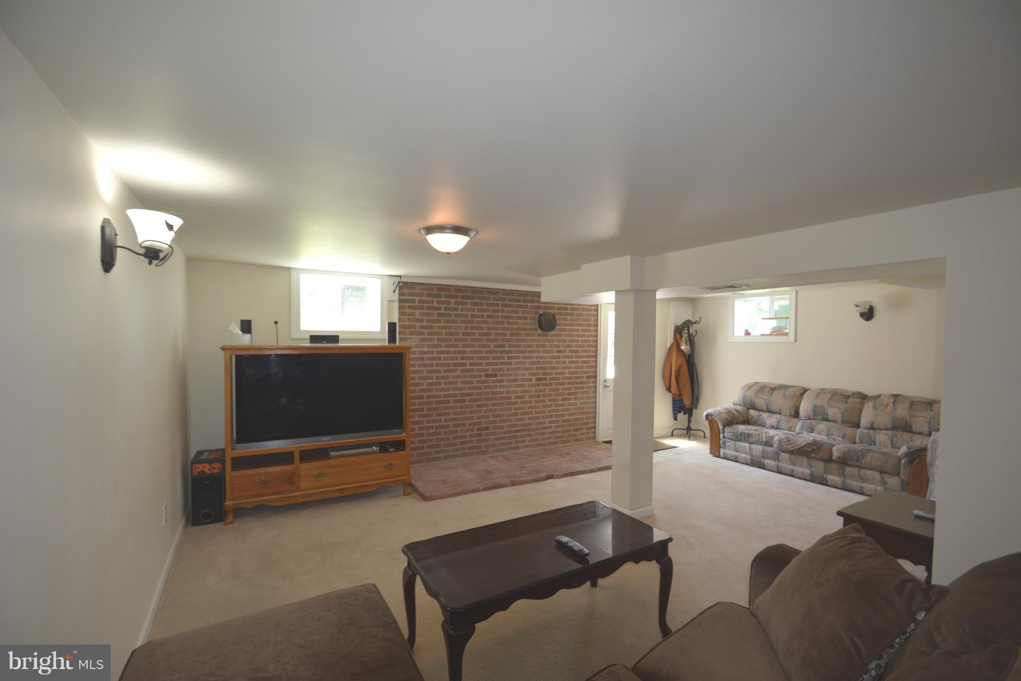 165 Lockhouse Road Falling Waters, WV 25419 - Photo 11 of 18 a living room with furniture and a flat screen tv