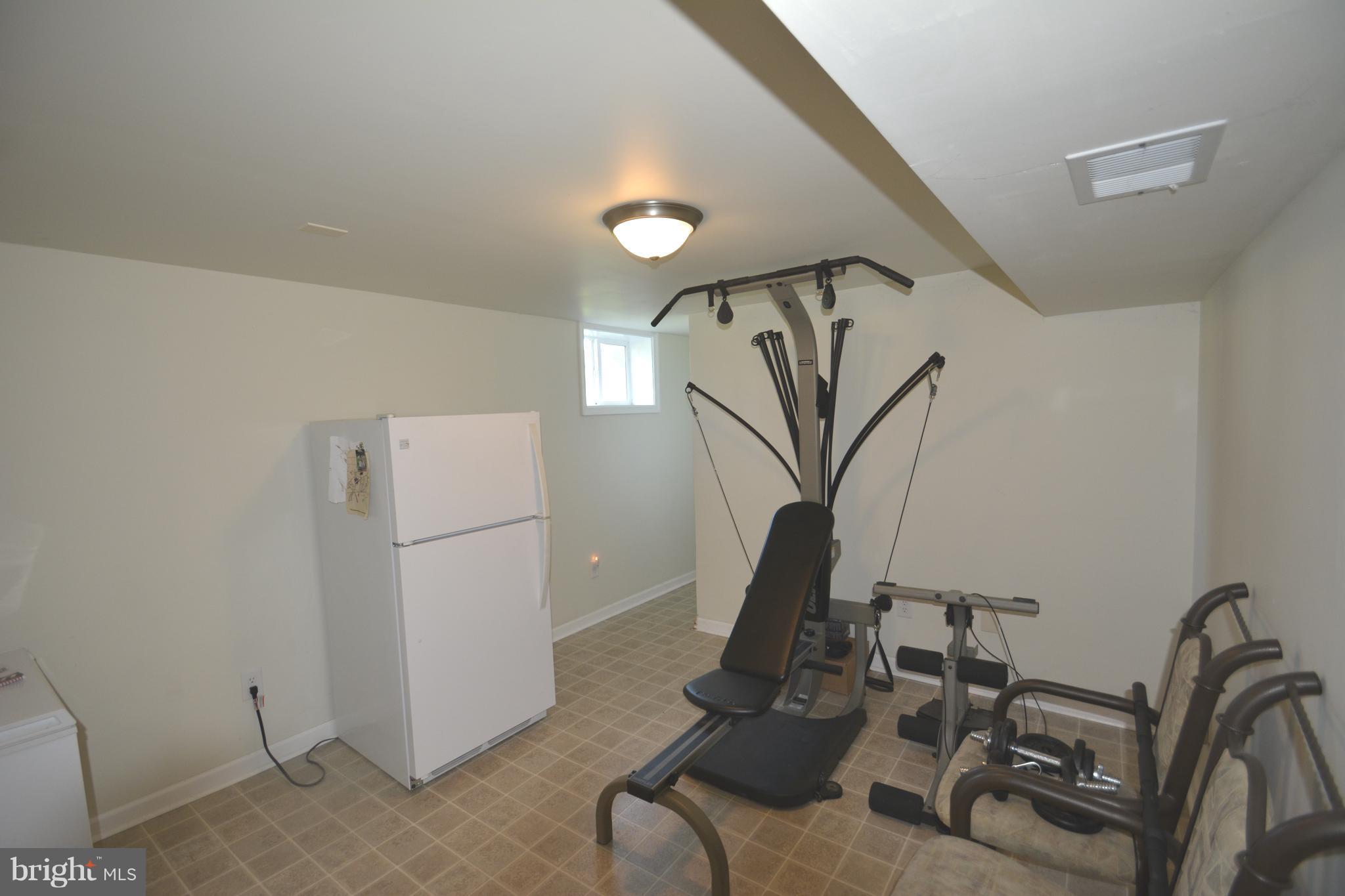 165 Lockhouse Road Falling Waters, WV 25419 - Photo 13 of 18 a view of a room with gym equipment