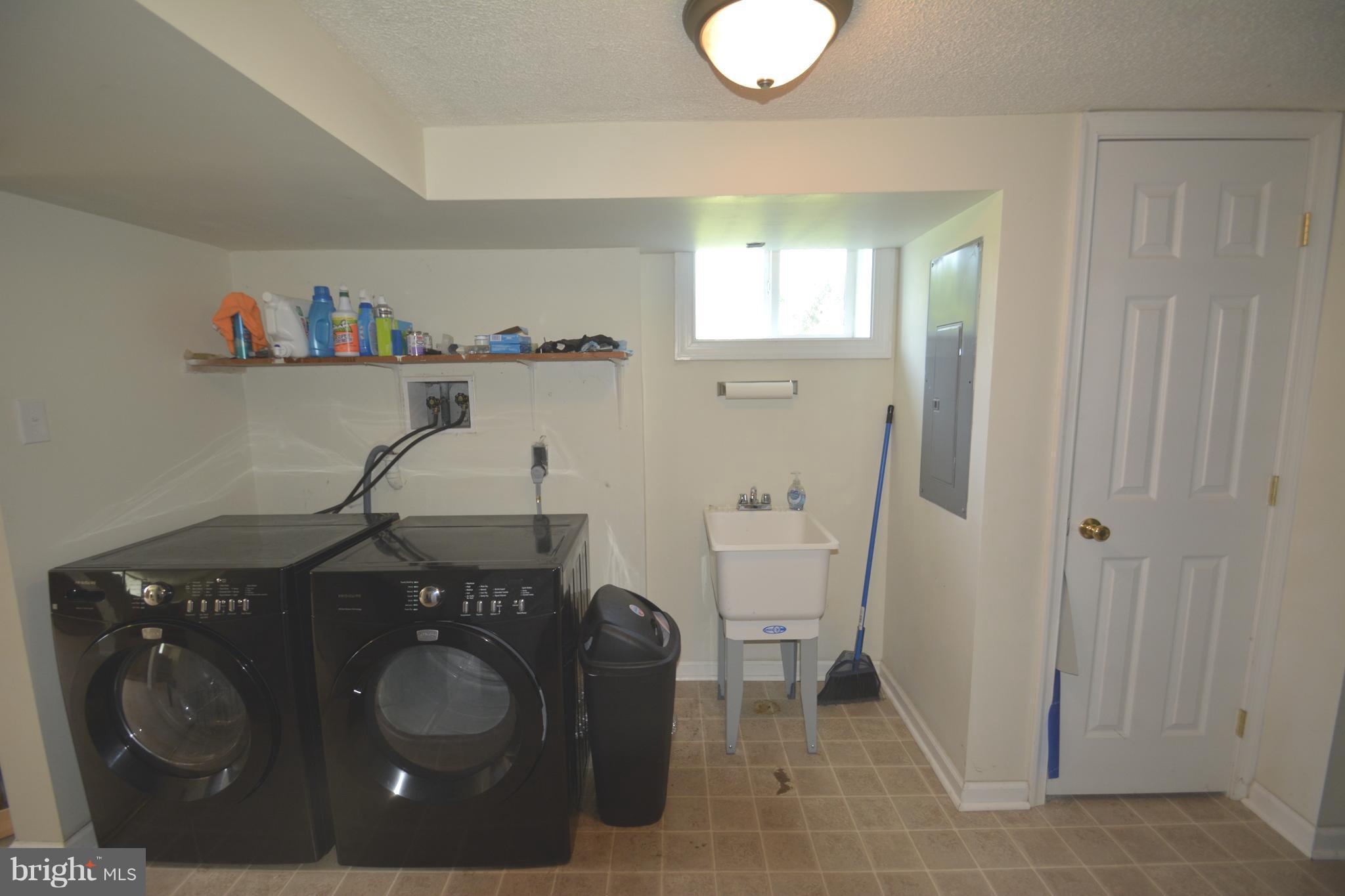 165 Lockhouse Road Falling Waters, WV 25419 - Photo 14 of 18 a utility room with sink dryer and washer
