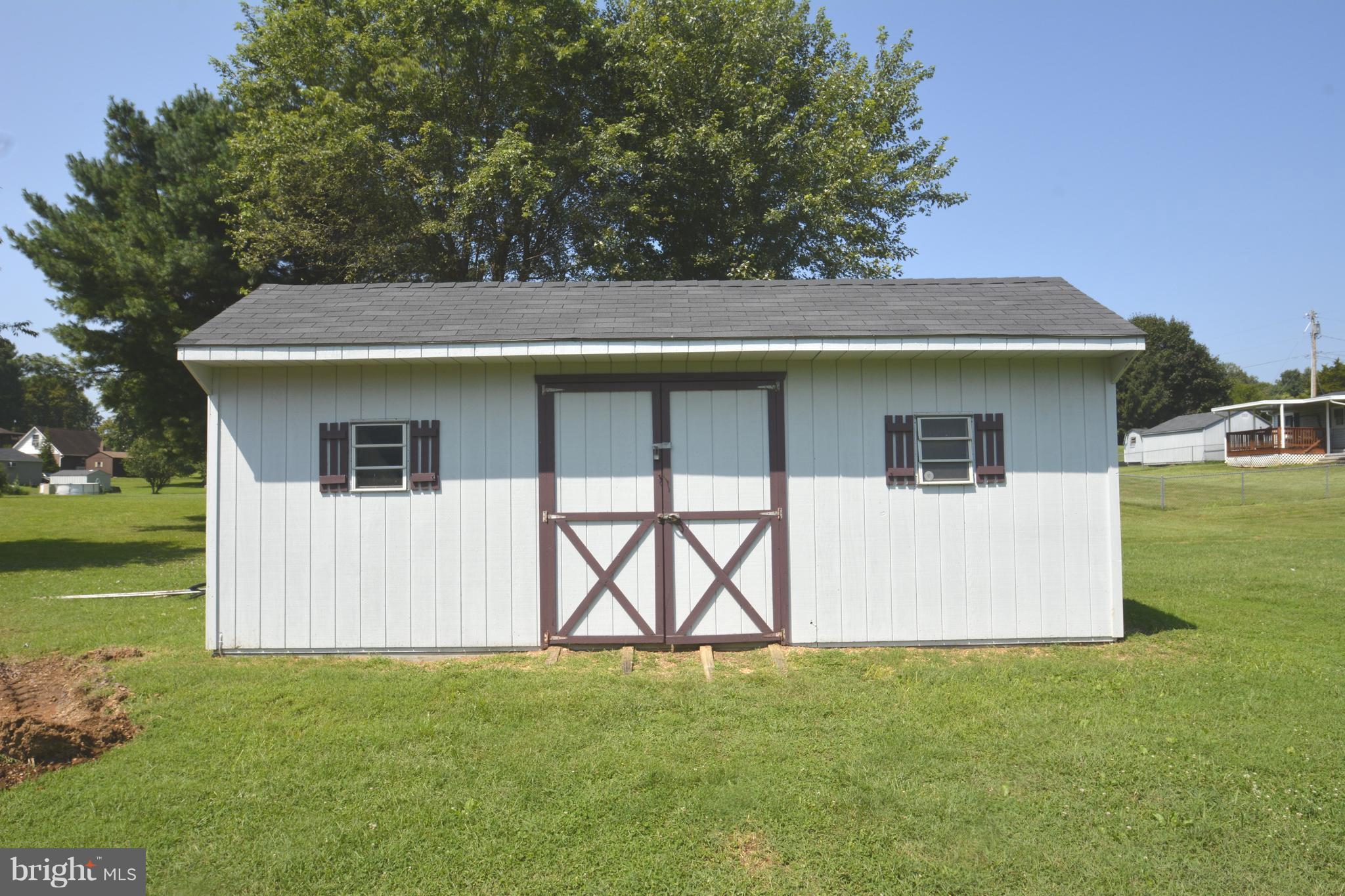 165 Lockhouse Road Falling Waters, WV 25419 - Photo 15 of 18 a house with garden in front of it