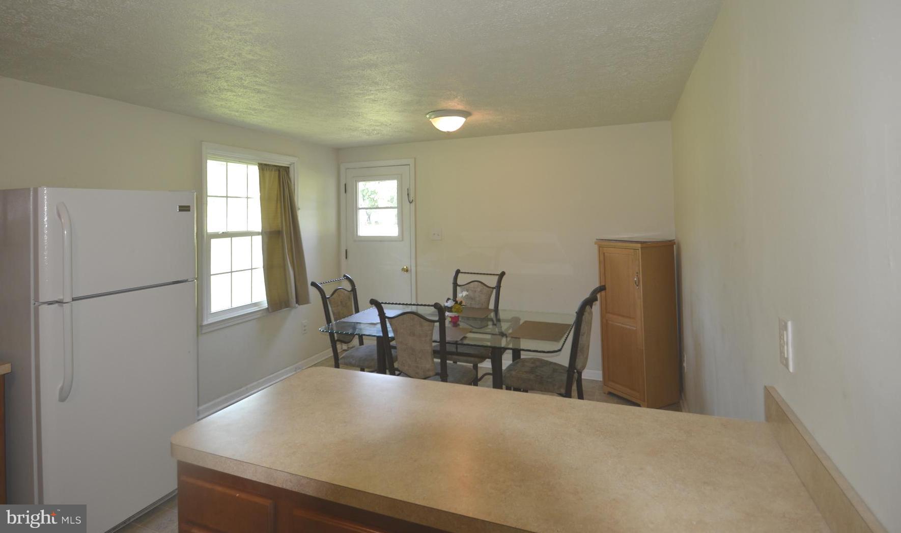 165 Lockhouse Road Falling Waters, WV 25419 - Photo 5 of 18 a view of a dining room with furniture and window