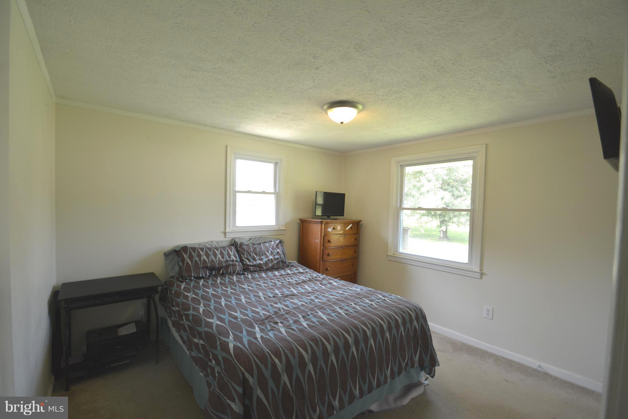 165 Lockhouse Road Falling Waters, WV 25419 - Photo 6 of 18 a bedroom with a bed and a window