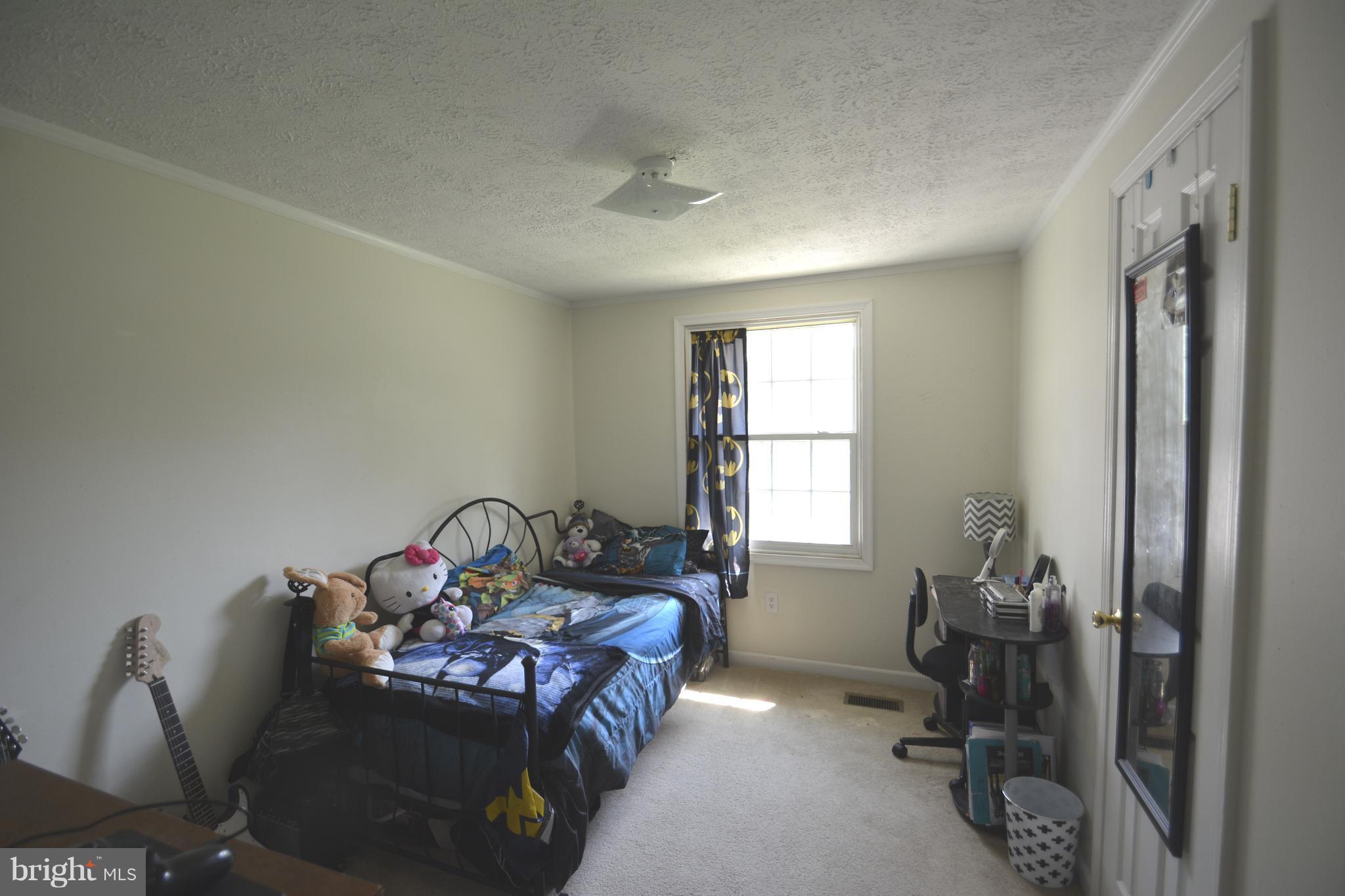 165 Lockhouse Road Falling Waters, WV 25419 - Photo 9 of 18 a bedroom with furniture and a window