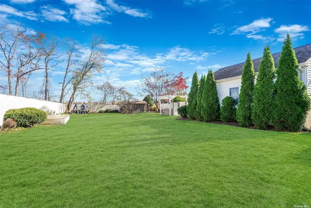 a backyard of a house with lots of green space