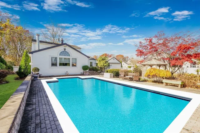 a view of a house with swimming pool