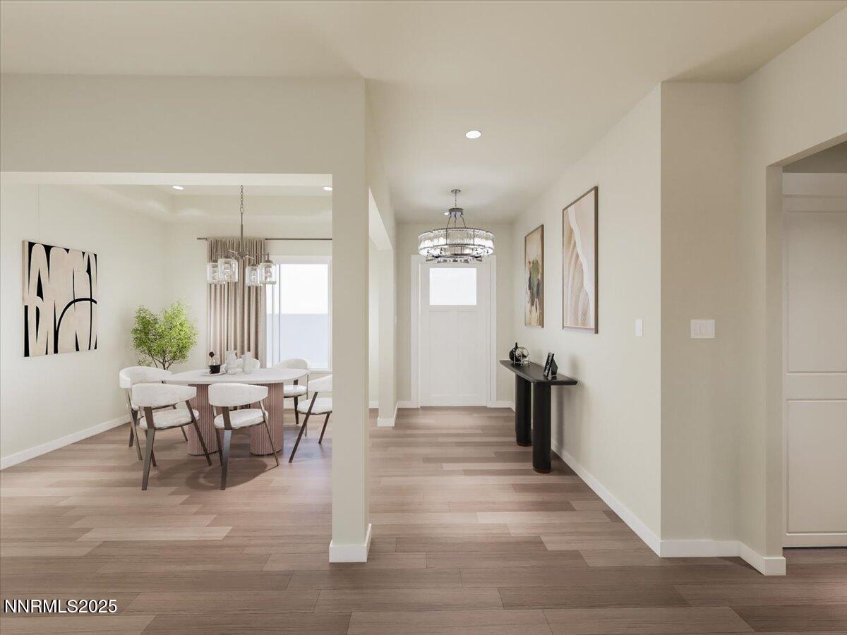 2756 Squires Street Minden, NV 89423 - Photo 3 of 10 a living room with furniture a wooden floor and a chandelier