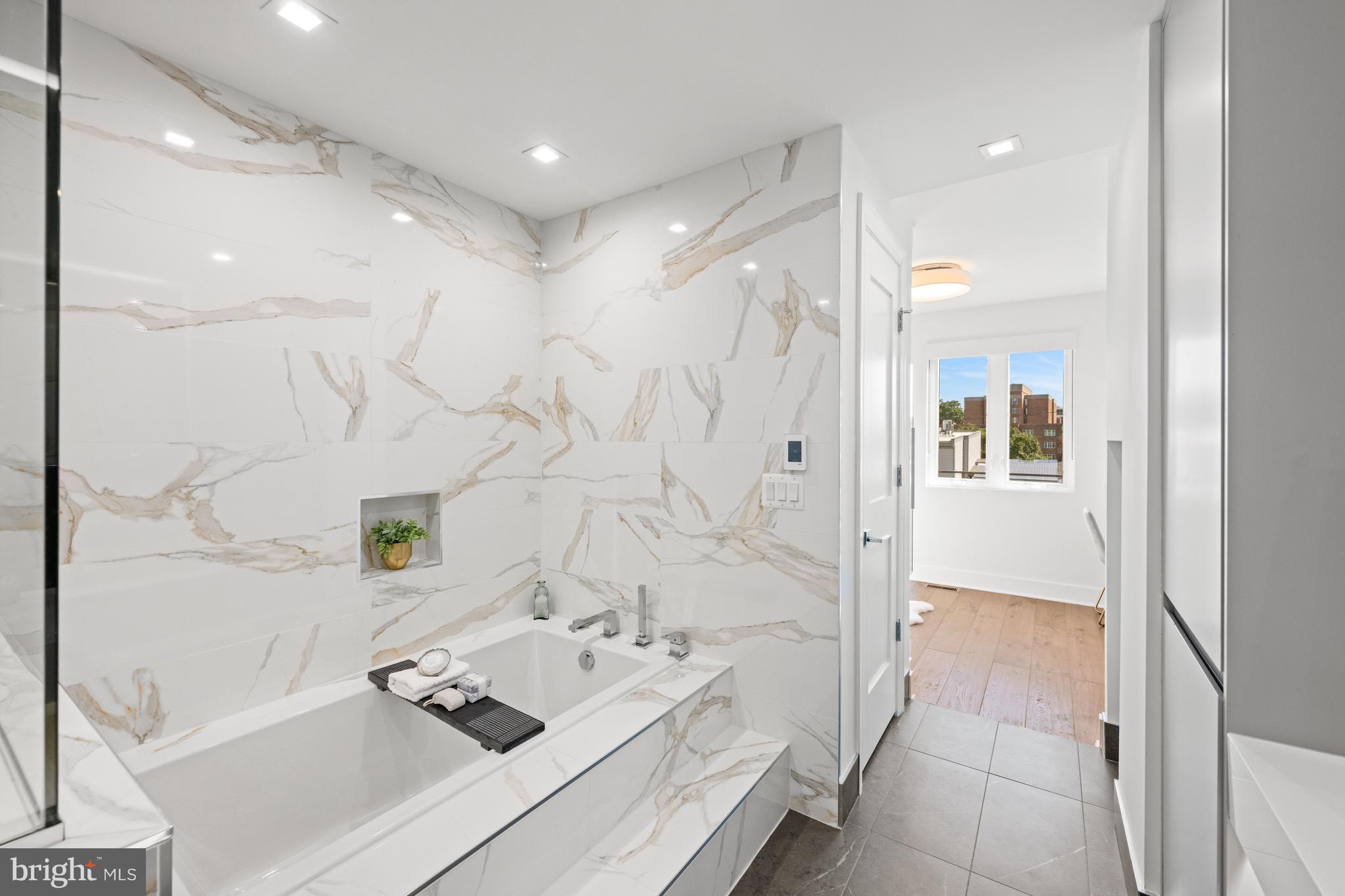 3728 R Street Northwest Washington, DC 20007 - Photo 13 of 34 a bathroom with a bathtub sink and mirror