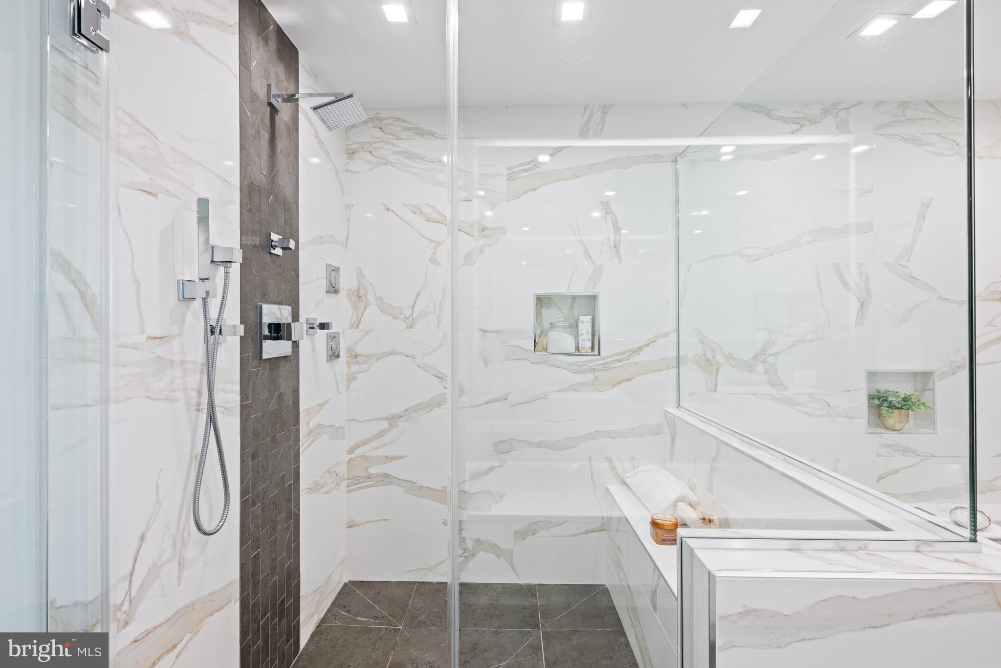 3728 R Street Northwest Washington, DC 20007 - Photo 15 of 34 a bathroom with a glass shower door