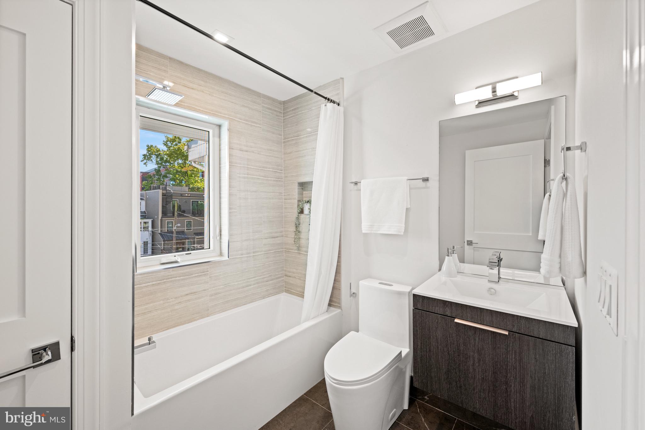 3728 R Street Northwest Washington, DC 20007 - Photo 21 of 34 a bathroom with a sink toilet and shower