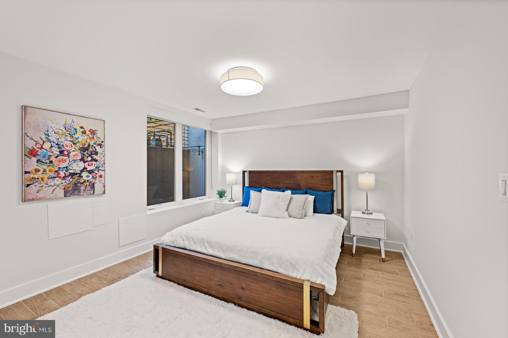 3728 R Street Northwest Washington, DC 20007 - Photo 23 of 34 a bedroom with a bed and a painting on the wall