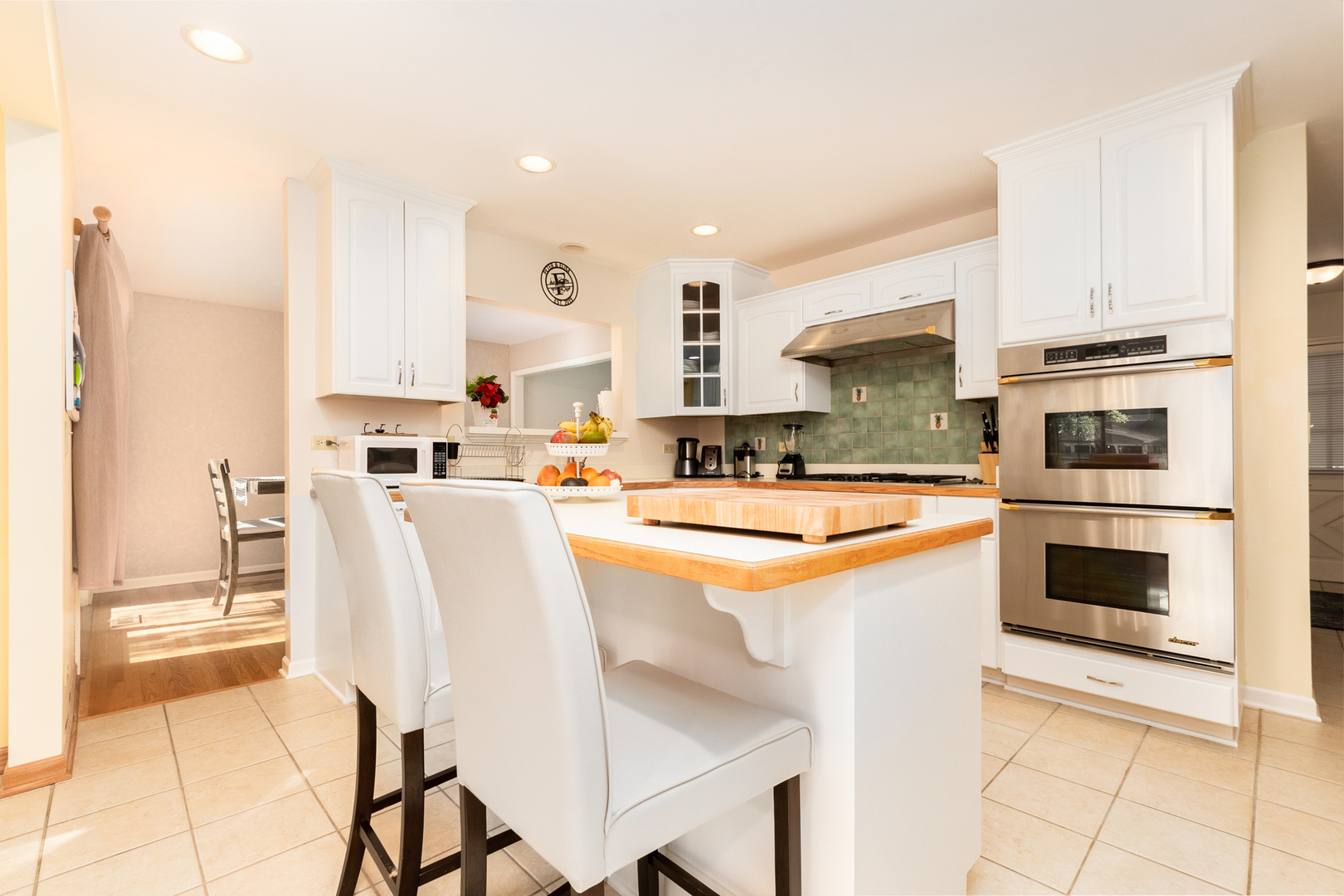 417 South River Road Naperville, IL 60540 - Photo 3 of 26 a kitchen with stainless steel appliances kitchen island granite countertop a stove a sink and a refrigerator