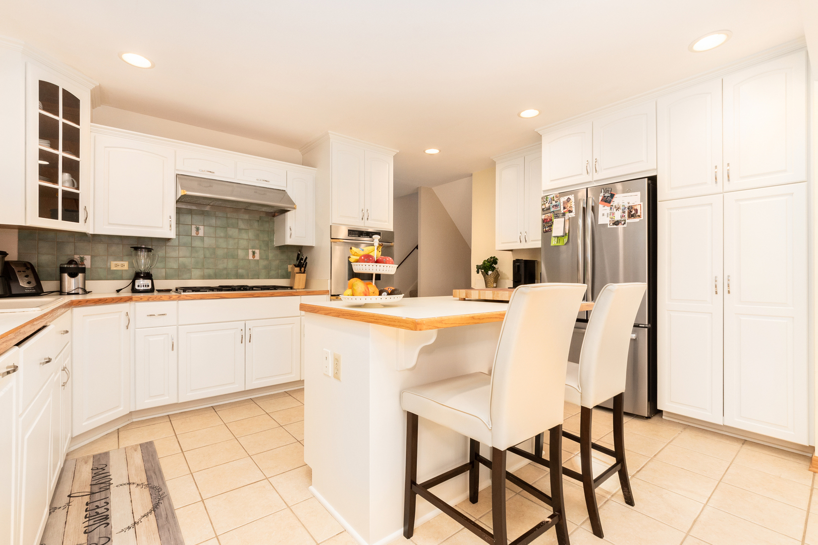 417 South River Road Naperville, IL 60540 - Photo 4 of 26 a kitchen with stainless steel appliances kitchen island granite countertop a refrigerator and cabinets