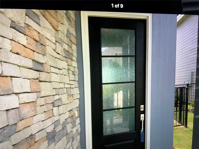 a bathroom with a glass door