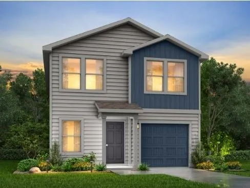 a front view of a house with garden and garage