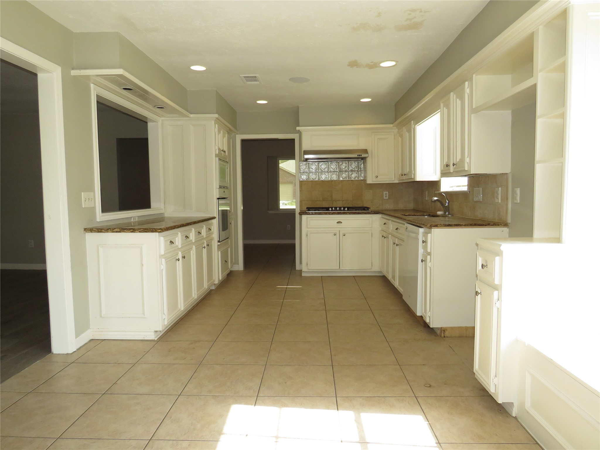 18703 Shay Lane Humble, TX 77346 - Photo 4 of 18 a large kitchen with stainless steel appliances granite countertop a large counter top and a stove