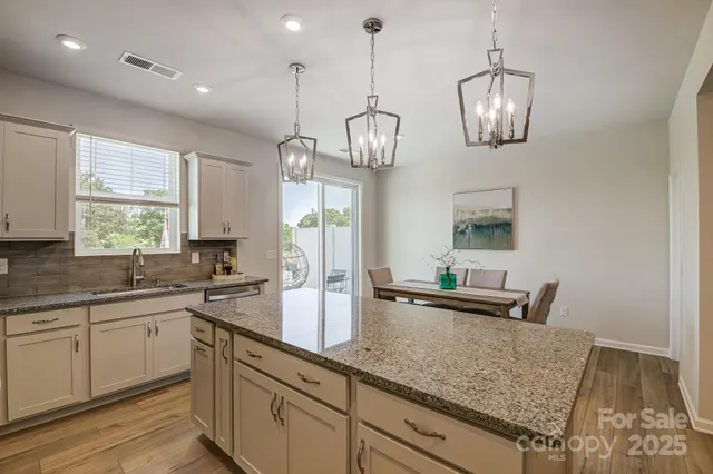 a kitchen with lots of counter space and a sink
