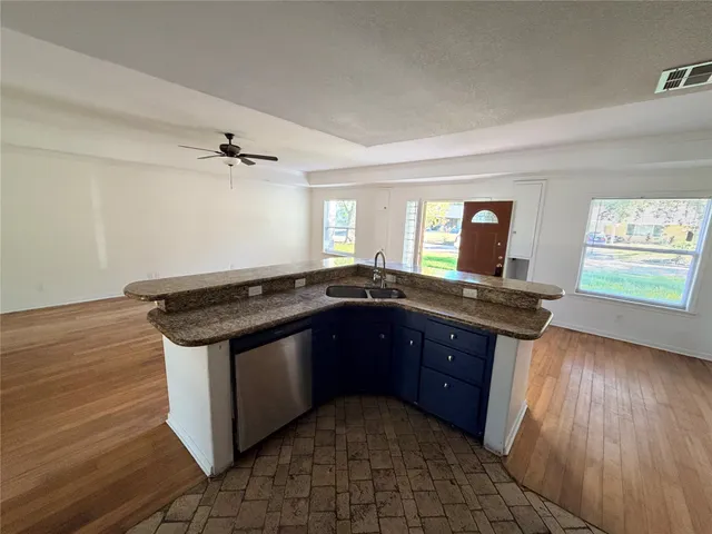 a kitchen with a stove and a sink