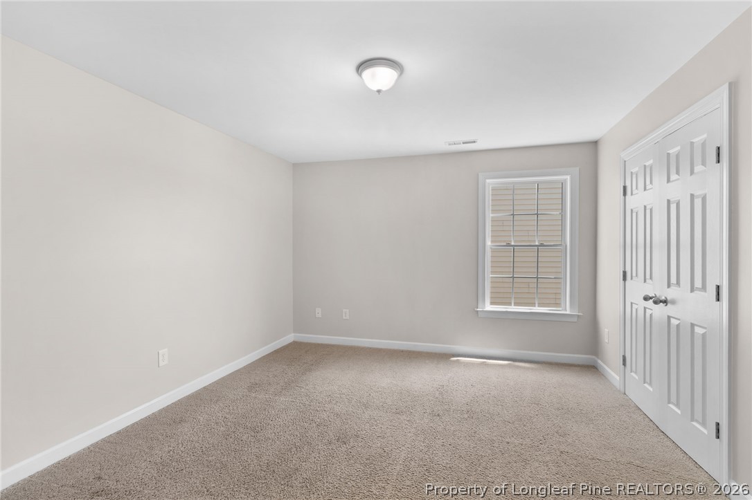 50 Huzzas Circle Cameron, NC 28326 - Photo 21 of 39 an empty room with windows
