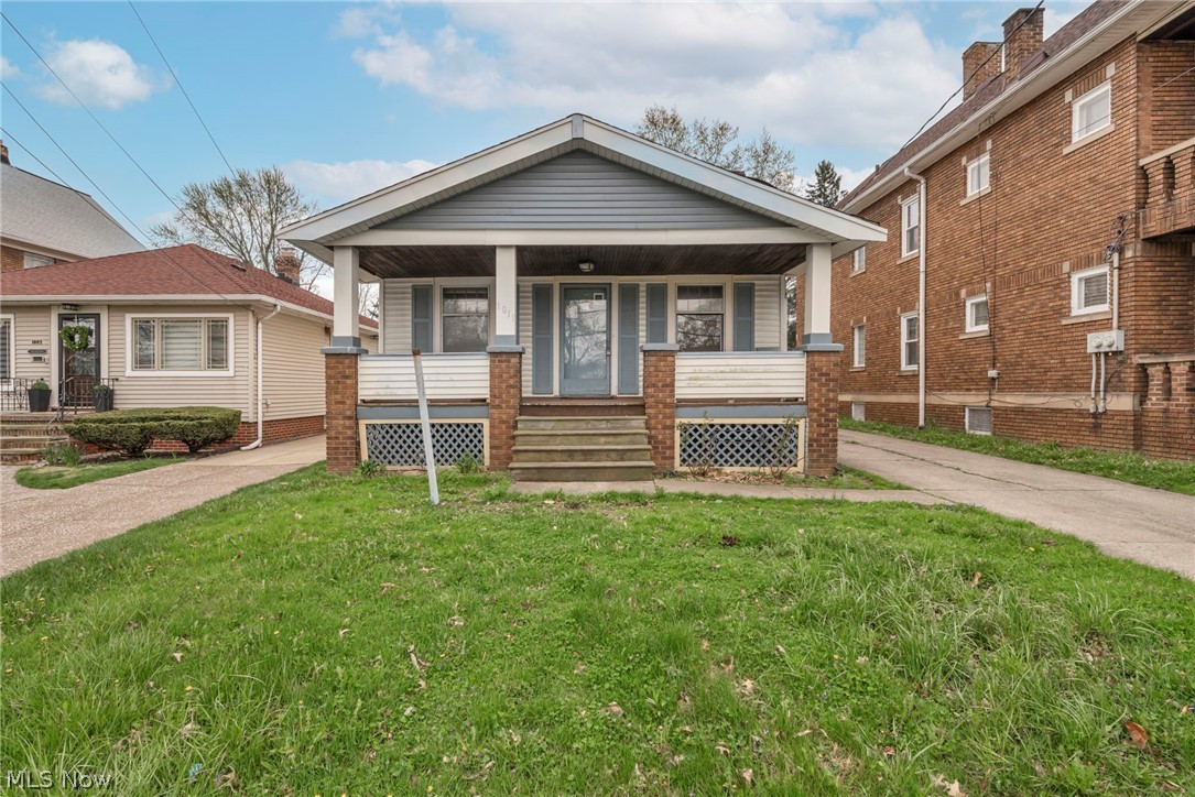 1011 Spring Road Cleveland, OH 44109 - Photo 2 of 47 View of front of home with a porch and a front lawn