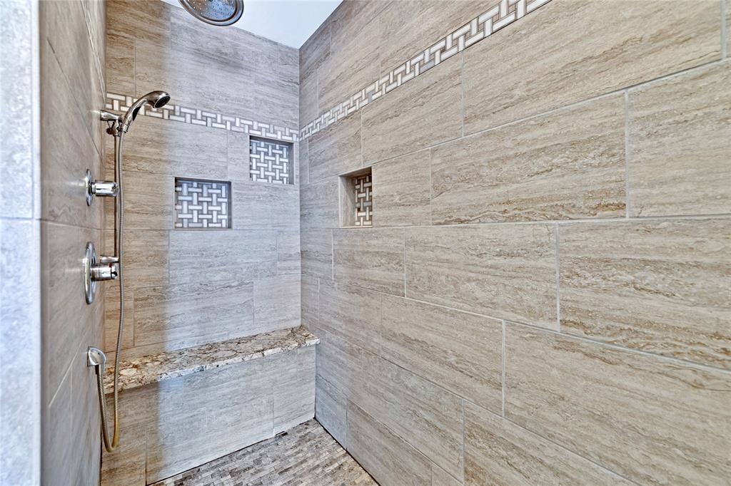 710 Cimarron Trail Irving, TX 75063 - Photo 15 of 39 a bathroom with a shower