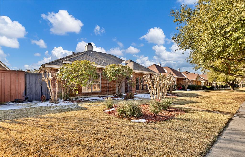 710 Cimarron Trail Irving, TX 75063 - Photo 2 of 39 a view of a house with a snow in the yard
