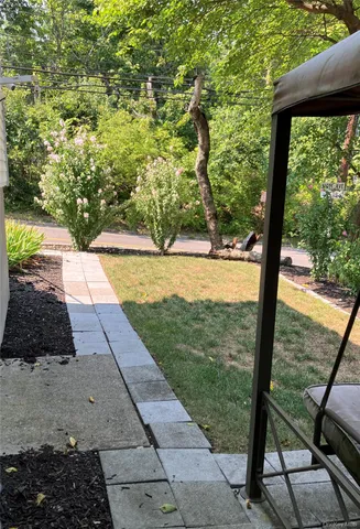 a view of swimming pool from a yard