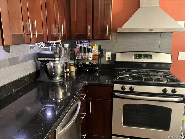 a kitchen with a stove and a microwave