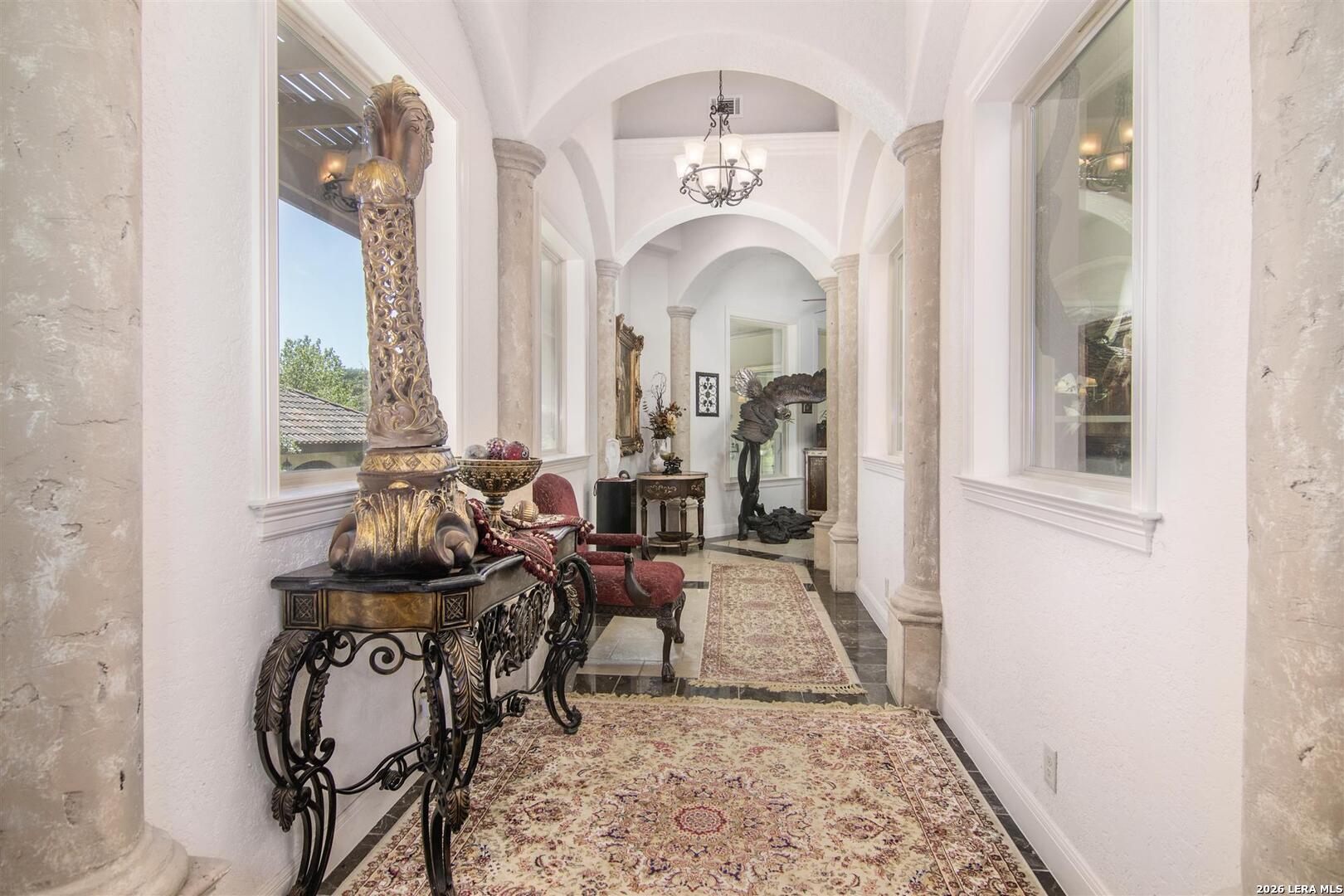 9469 Canyon Mist Helotes, TX 78023 - Photo 12 of 50 a living room with furniture and a chandelier