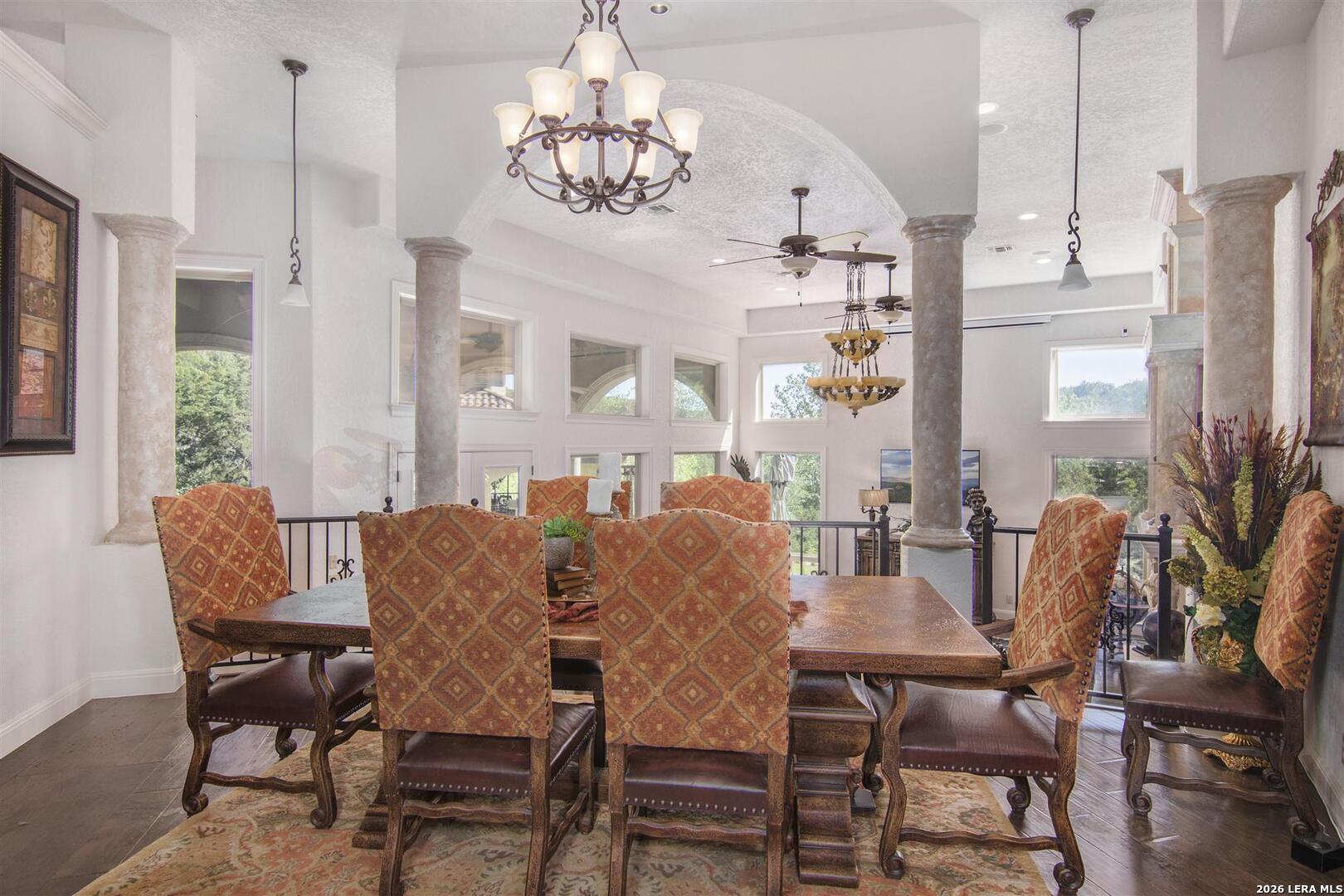 9469 Canyon Mist Helotes, TX 78023 - Photo 18 of 50 a view of a dining room with furniture window and wooden floor