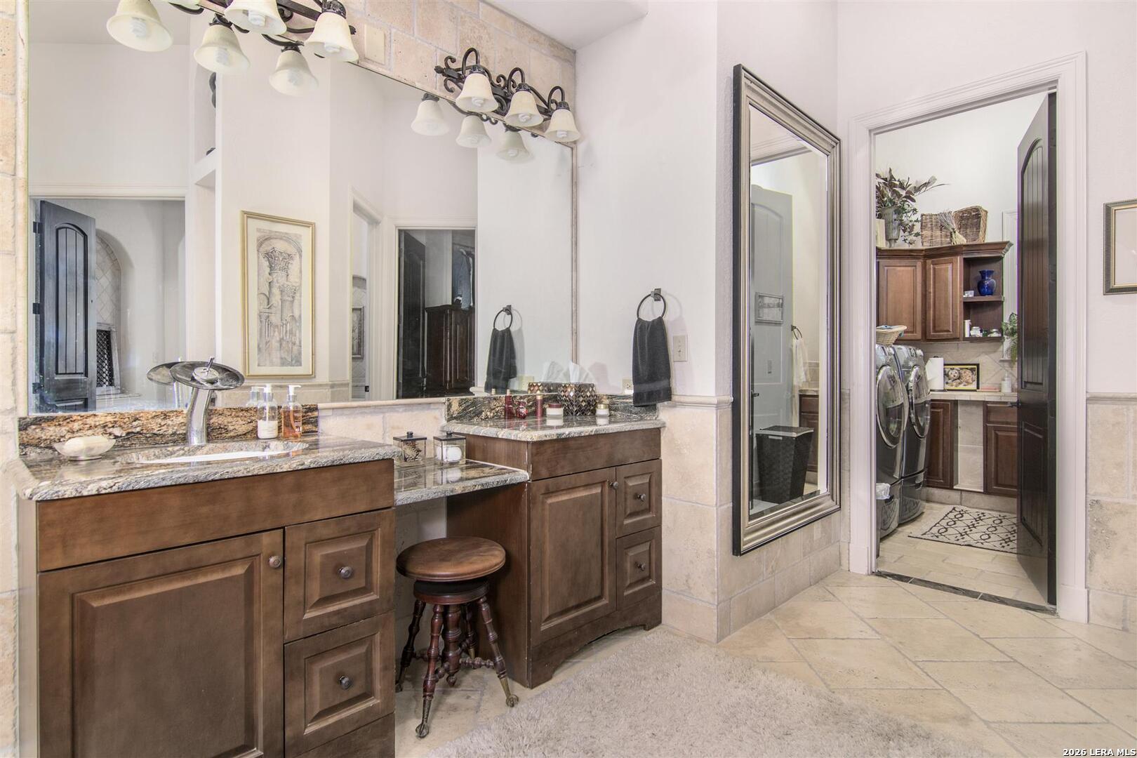 9469 Canyon Mist Helotes, TX 78023 - Photo 22 of 50 a bathroom with a sink a toilet and shower