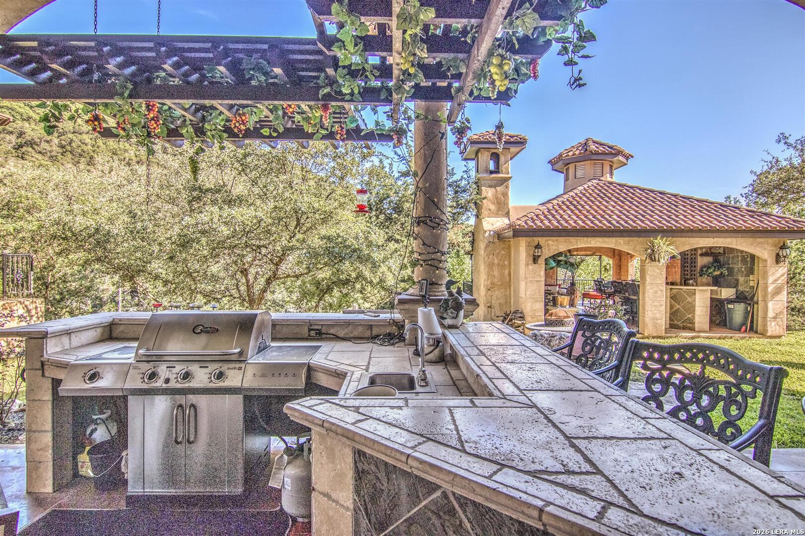 9469 Canyon Mist Helotes, TX 78023 - Photo 25 of 50 a view of a house with a porch