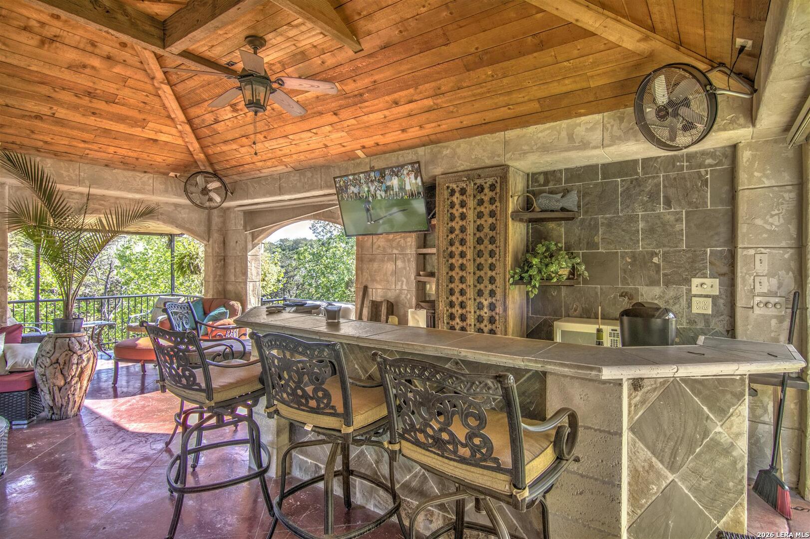 9469 Canyon Mist Helotes, TX 78023 - Photo 28 of 50 a view of a chairs and table in a patio