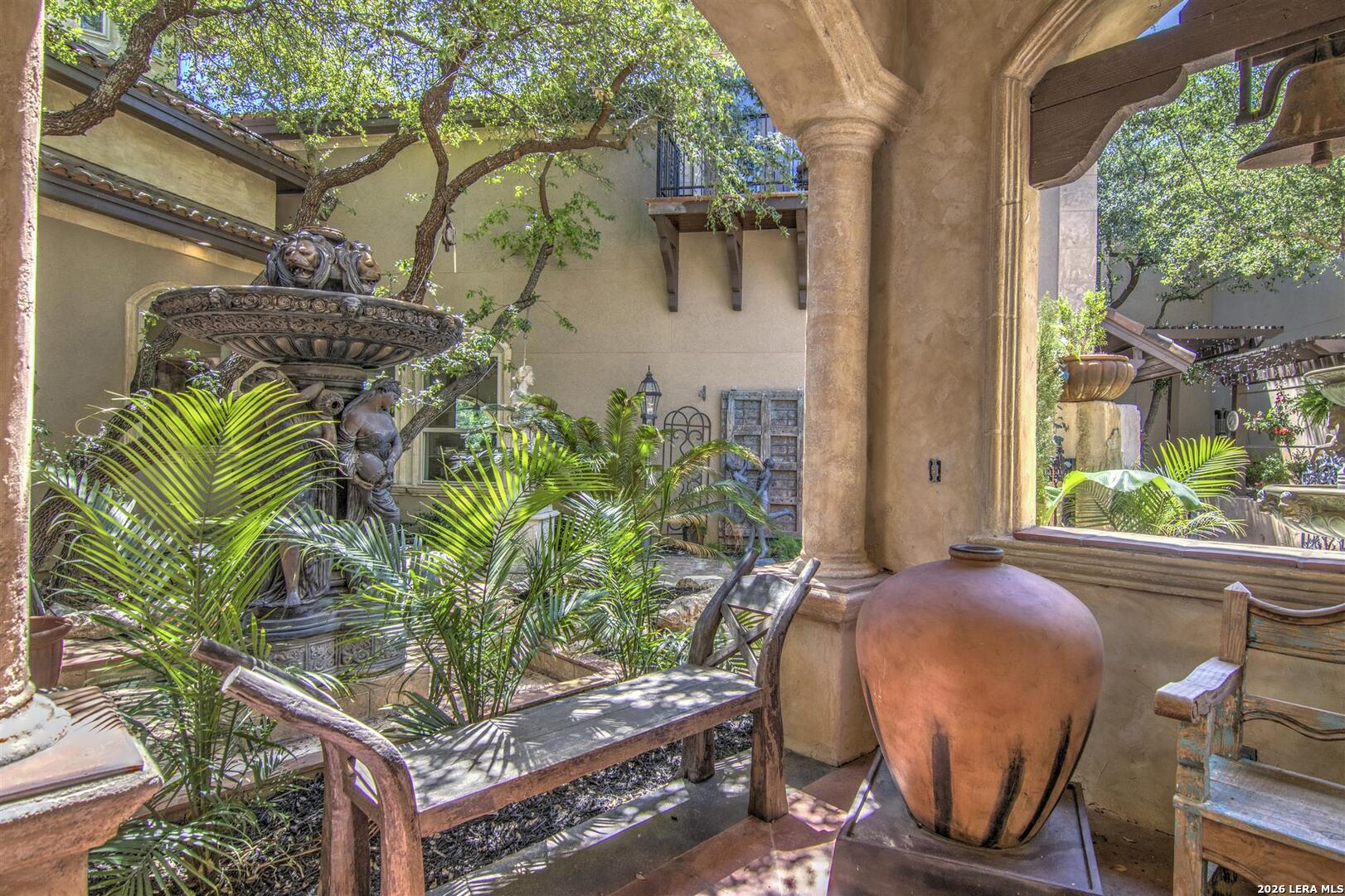 9469 Canyon Mist Helotes, TX 78023 - Photo 39 of 50 a view of a backyard with plants and outdoor seating