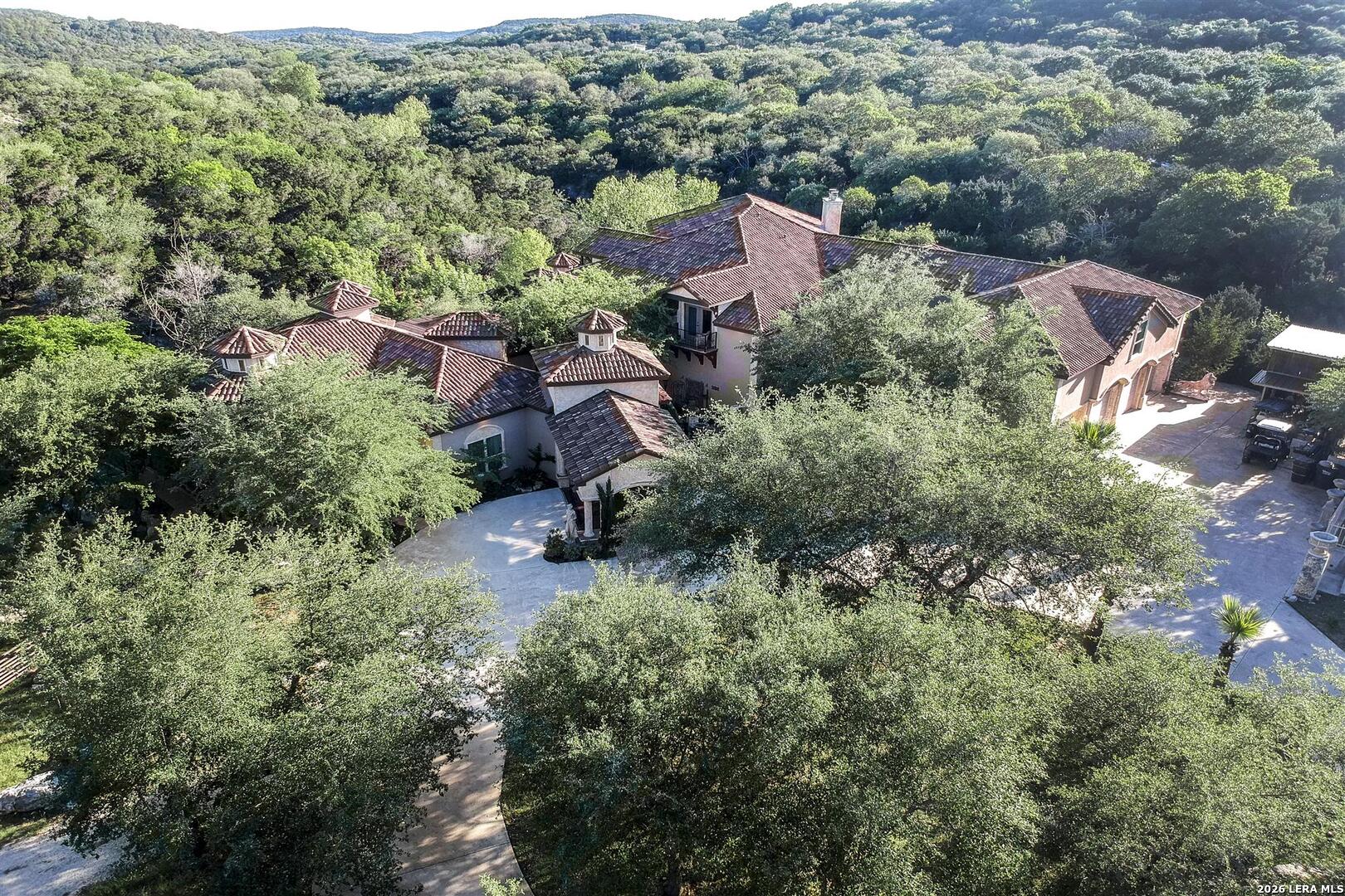 9469 Canyon Mist Helotes, TX 78023 - Photo 49 of 50 an aerial view of residential house with outdoor space and trees all around